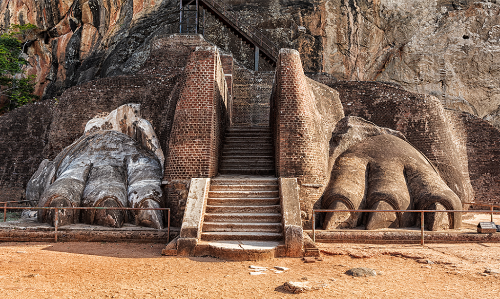 The famous Lion's Paw at Sigiriya, Sri Lanka. A large, sculpted paw of a lion is carved into the rock face, leading up a staircase to the summit.