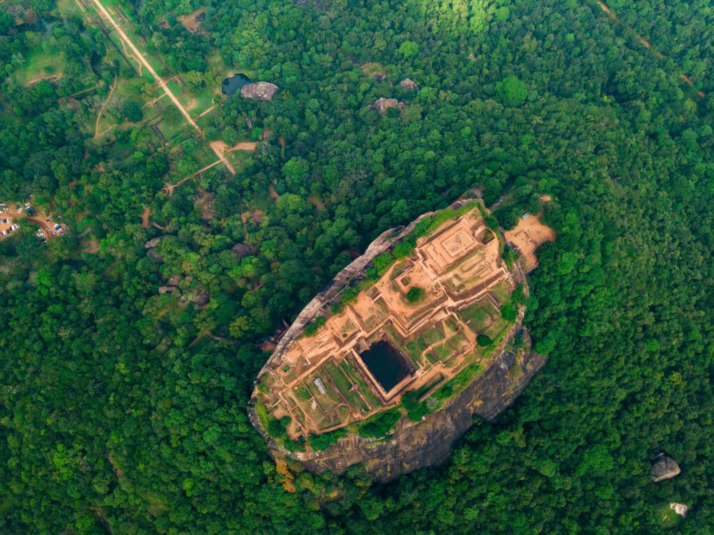 Sigiriya Rock, a UNESCO World Heritage Site in Sri Lanka and a popular tourist destination with an ancient fortress on its summit. It's known for its breathtaking views, historical significance, and the famous frescoes that adorn its walls.