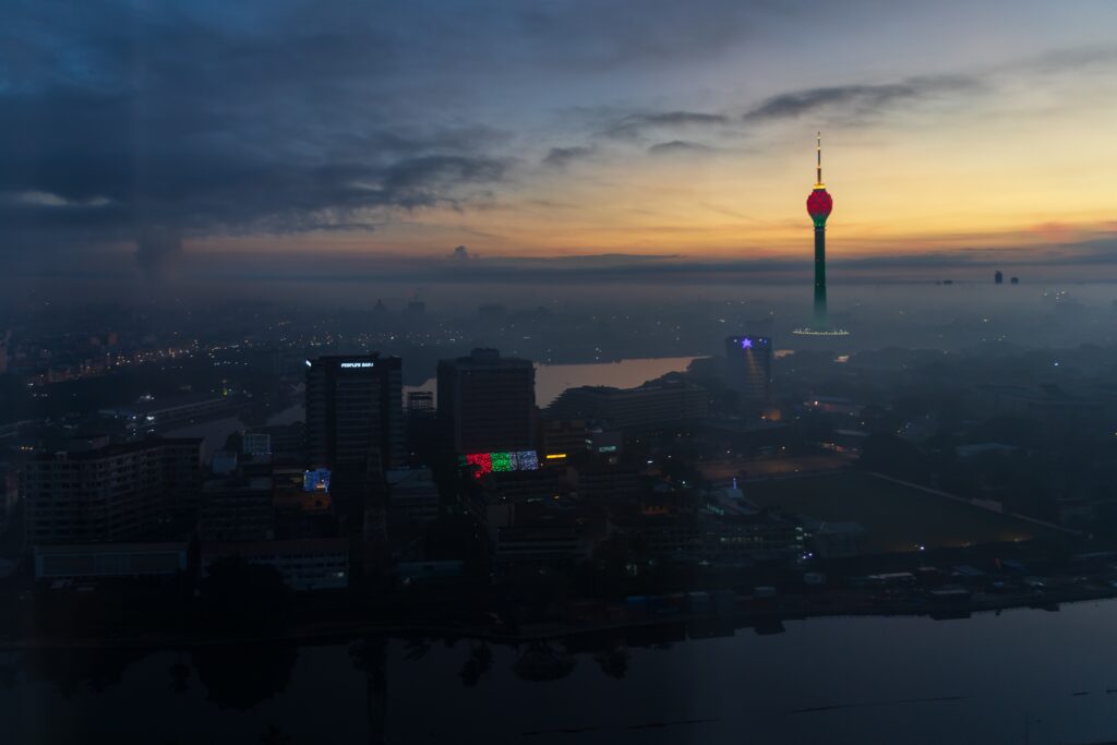 A peaceful early-morning image of the Colombo, Sri Lanka, skyline highlighted by the golden tones of the dawn. The famous Lotus Tower dominates the Colombo skyline.